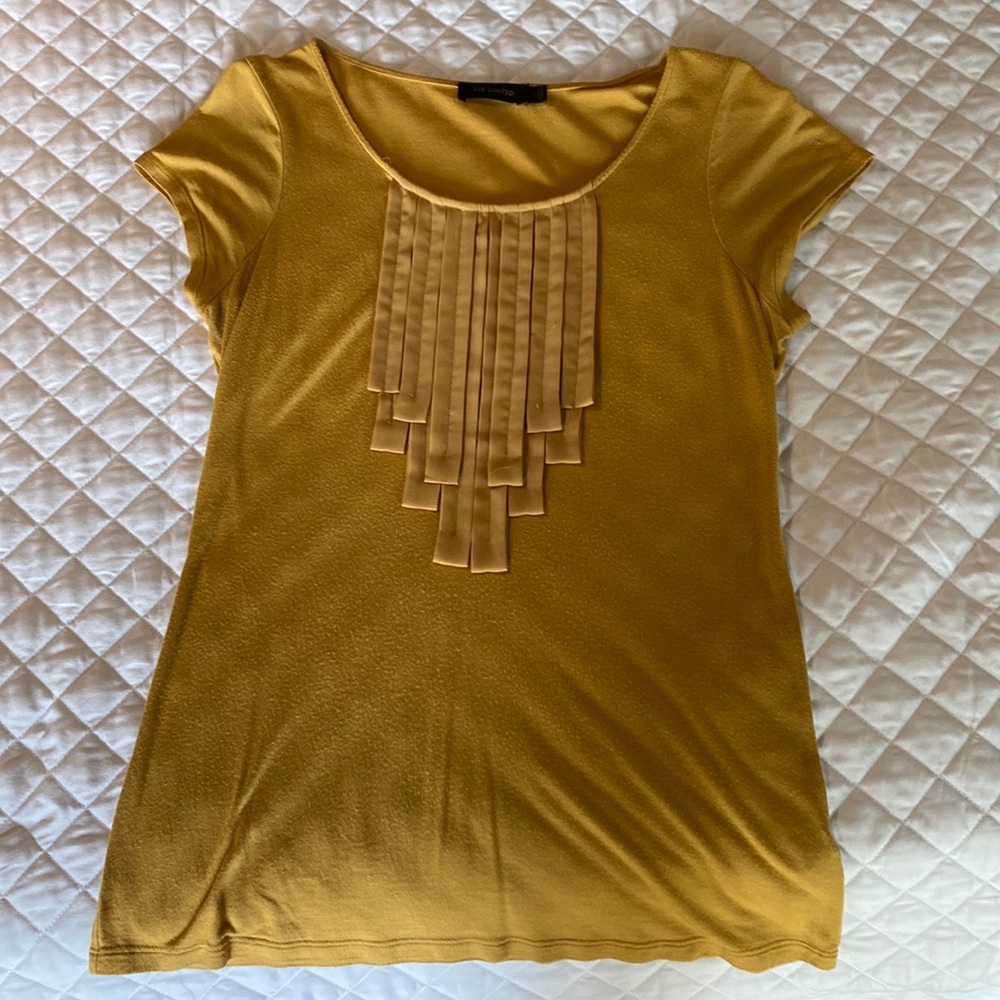 The limited shirt, this shirt is a yellow in coloration and is a Large size.